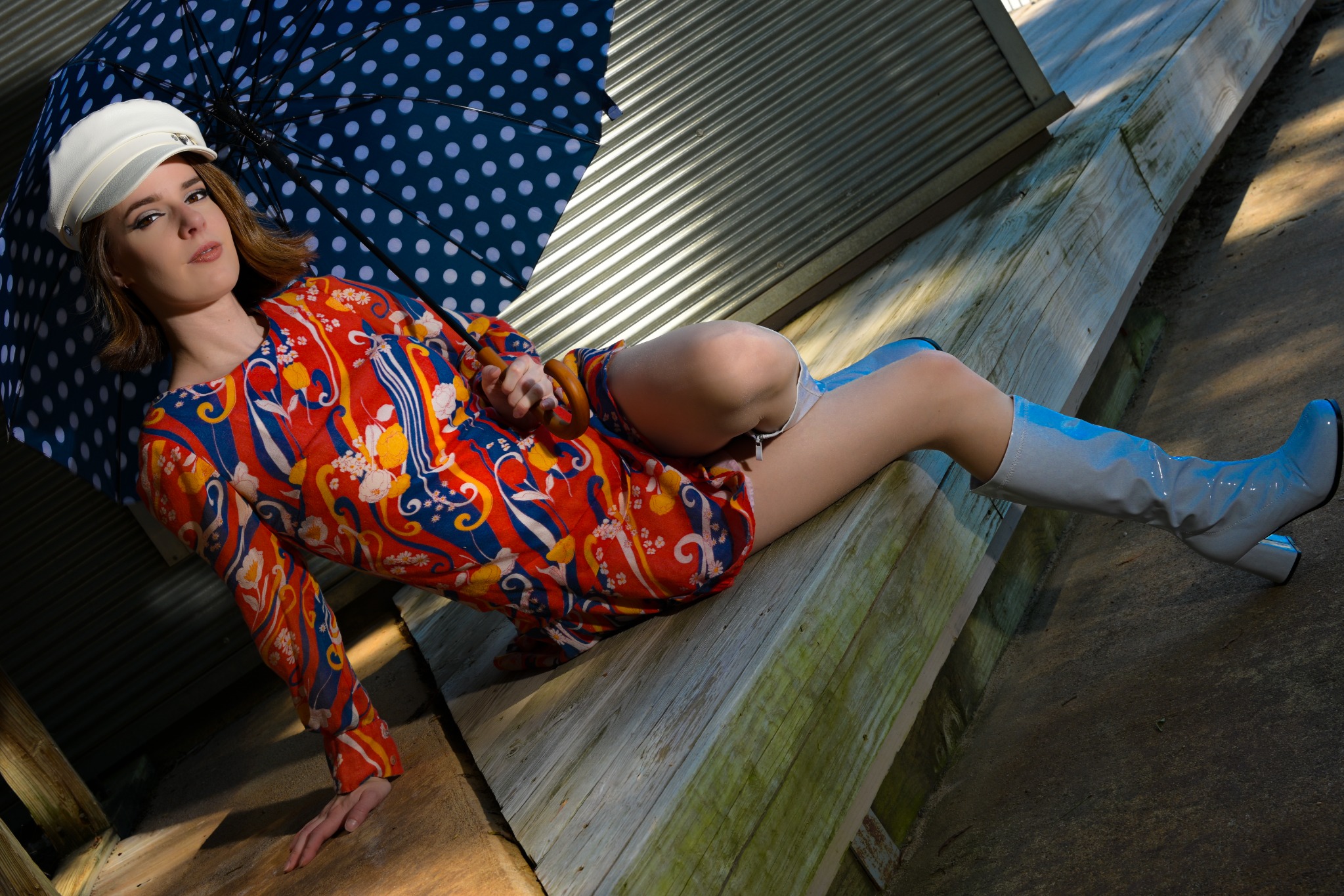 Colorful outdoor fashion portrait with a polka-dot umbrella